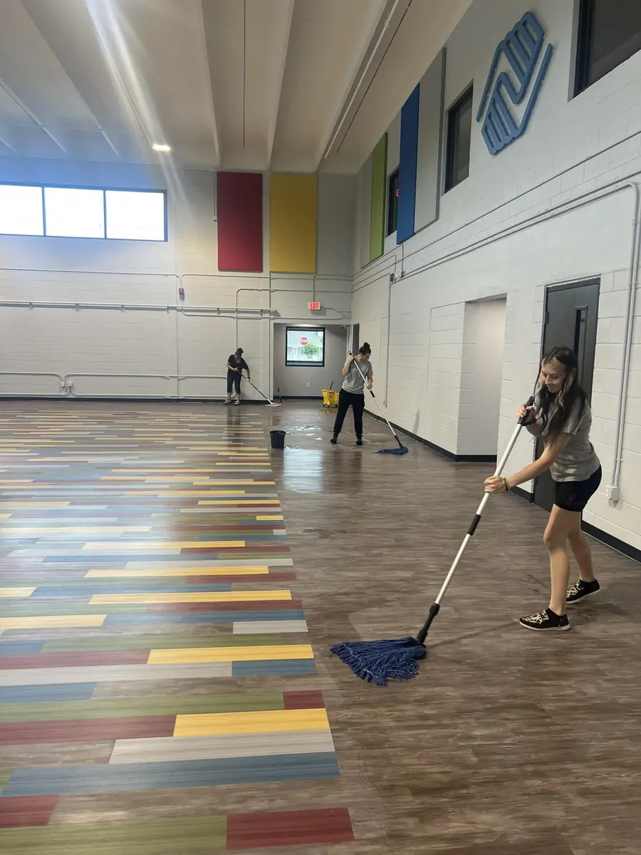 An Orchid Cleaning crew mopping the floors at the Boys & Girls Clubs of Polk County