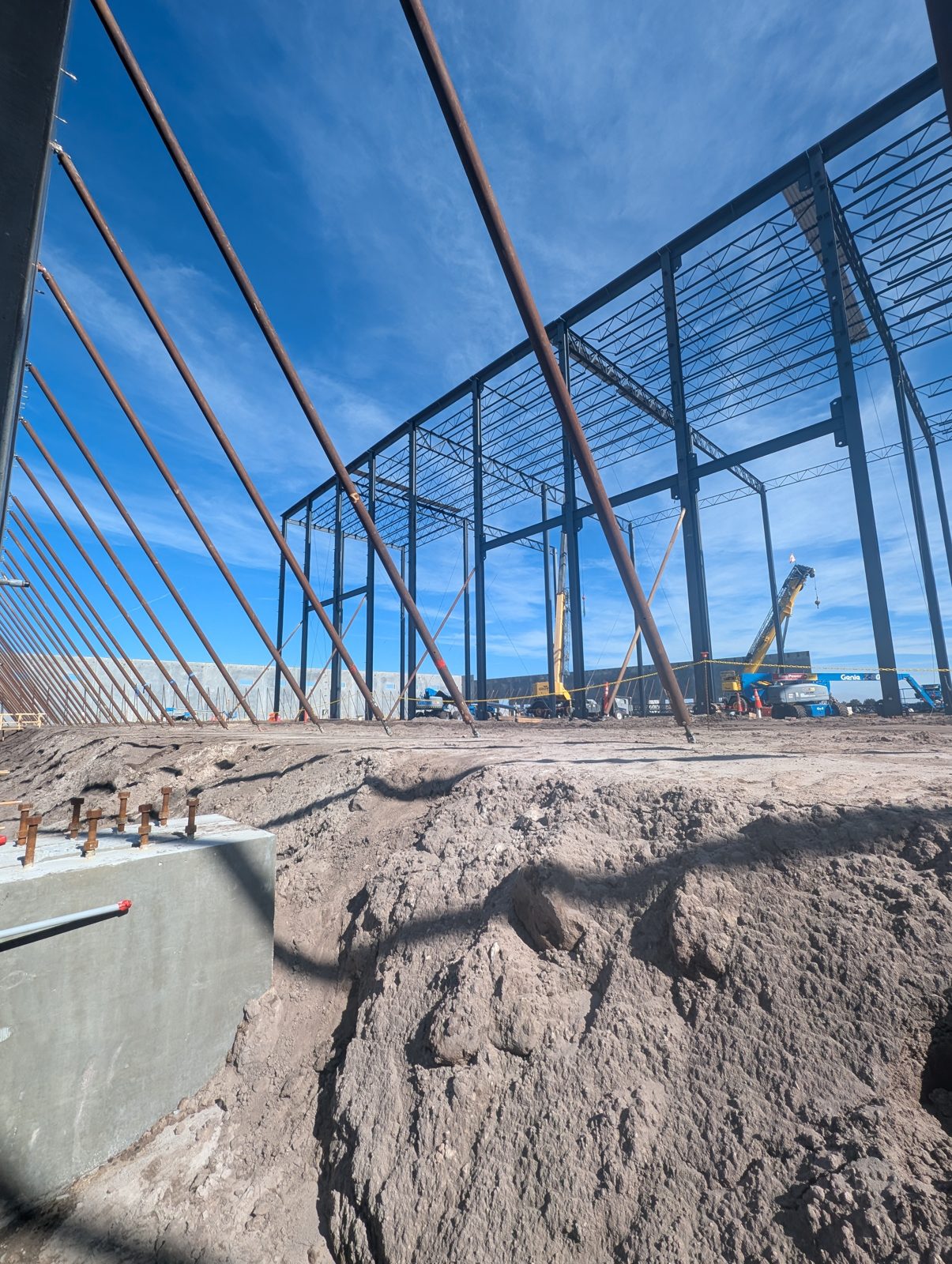 Structural steel and tilt-wall panels going up on a Polk County construction site of the kind Orchid Cleaning works through to handover