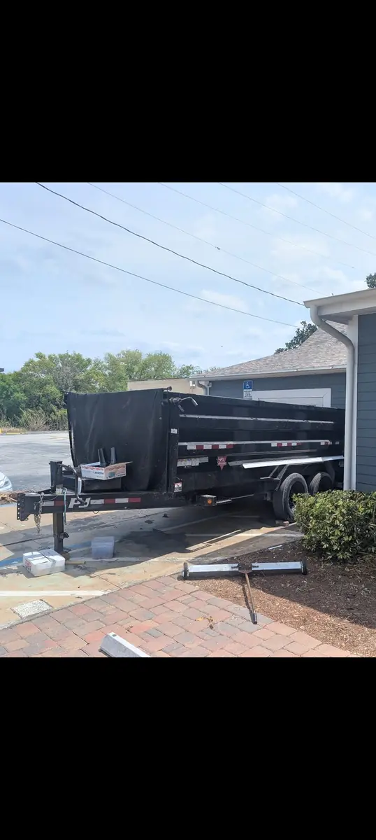 The Orchid Cleaning Service dump trailer used for cleanouts and debris removal