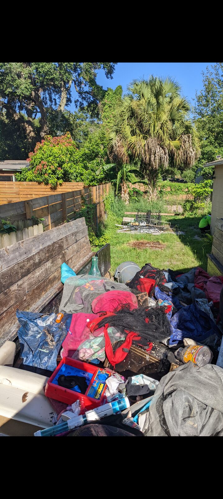 Orchid Cleaning crew hauling junk from a residential cleanout in Polk County, Florida