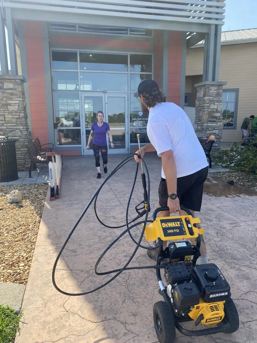 Orchid Cleaning Service pressure washing a commercial entryway